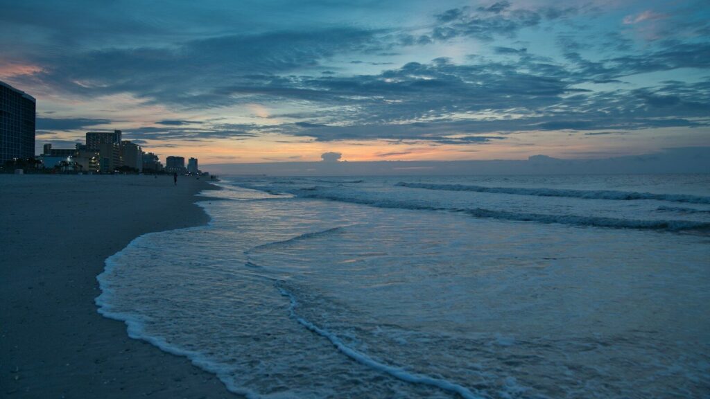 orange and blue sky at sunset over beach